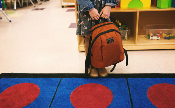 A child holding a full Sprout bag.